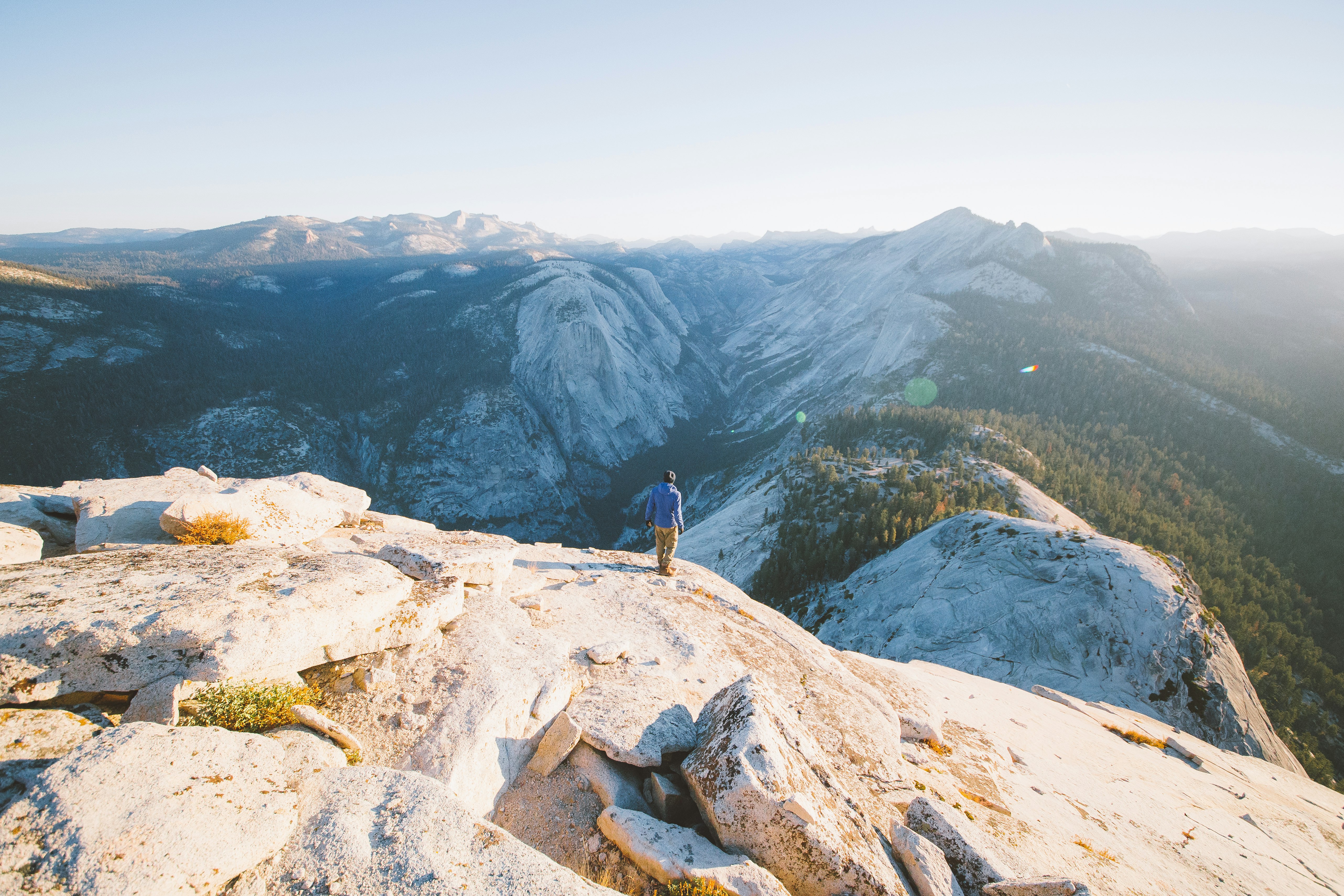 person standing on mountain during daytime